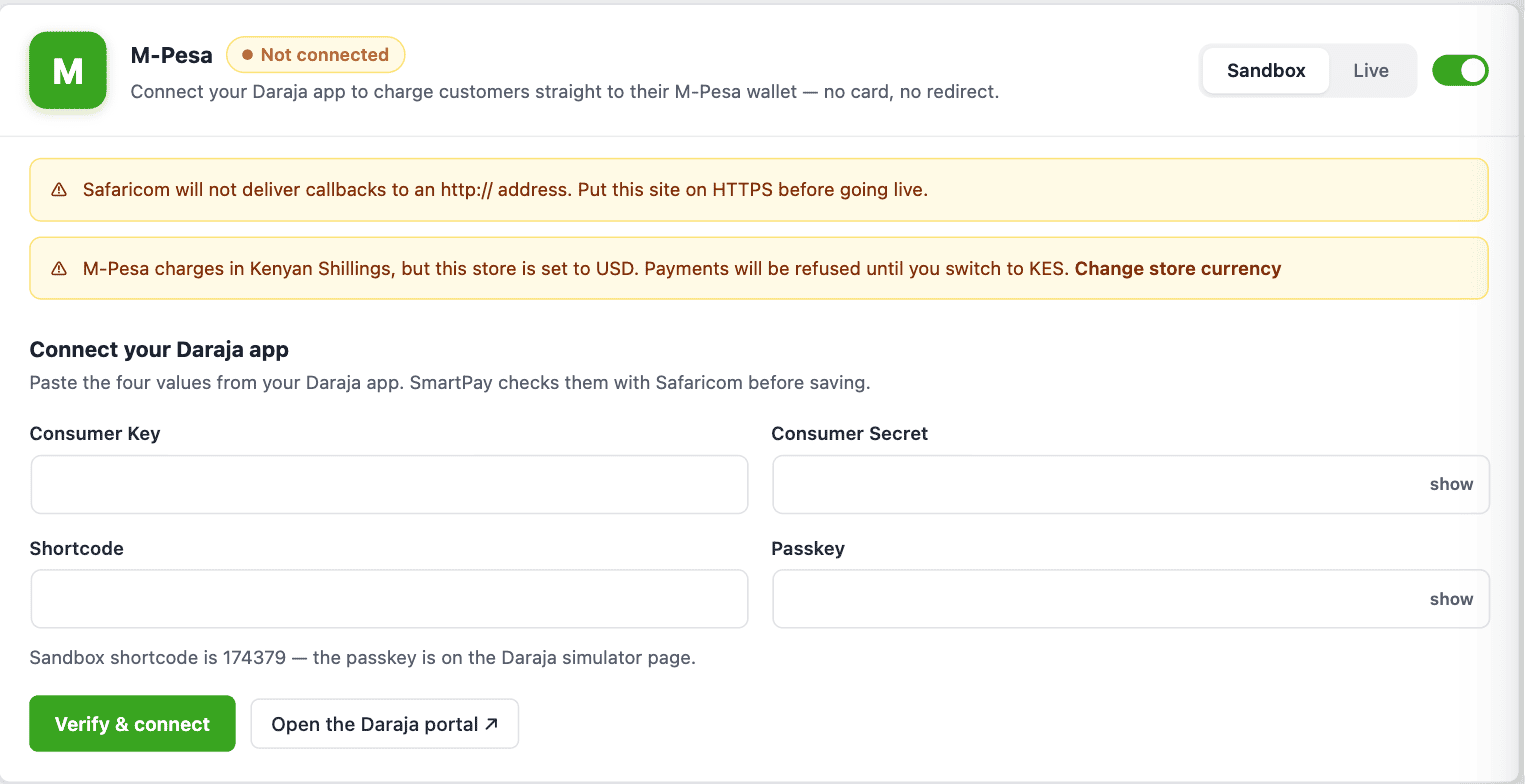 Screenshot of WP SmartPay M-Pesa gateway settings showing the connection card with Consumer Key, Consumer Secret, Shortcode and Passkey fields and the Sandbox/Live switch